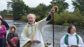 Newcomers to faith brave cold waters for river baptisms
