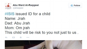 Islamic State baby pictured beside gun and hand grenade promises child will grow up to be a \'risk\'