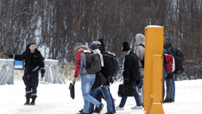 Norway tries to ease migrant crisis by offering refugees cash, free flights home