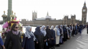 Muslim and Christian wall of defiance along Westminster Bridge