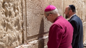 Archbishop of Canterbury prays for peace as he visits Christian, Jewish and Muslim sites in Jerusalem