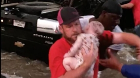 Baby pulled unconscious from flood waters starts breathing again as woman prays \'In the name of Jesus\'