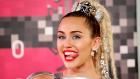 Miley Cyrus slams pregnancy rumors, says it's a food bump