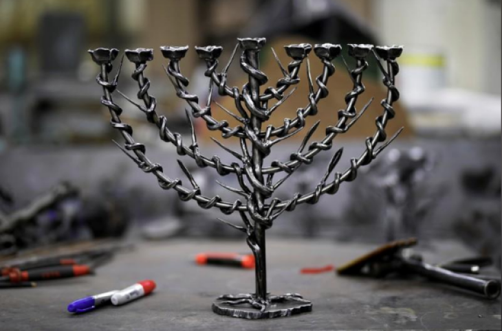 Israeli artist beats Gaza rockets into Hanukkah lamps - Christian Today