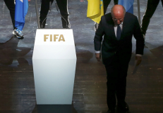FIFA: Blatter defies calls to step down as corruption scandal widens 