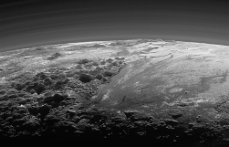 In far-away Pluto, surface water ice is red and sky is blue, similar to Earth\'sâNASA