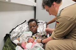 Baptism on board as refugee mother gives birth on naval ship